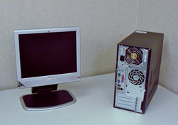 Monitor and computer case on desk
